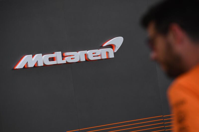 A man walks past the McLaren garage at the Albert Park circuit ahead of the Formula One Australian Grand Prix in Melbourne. AFP