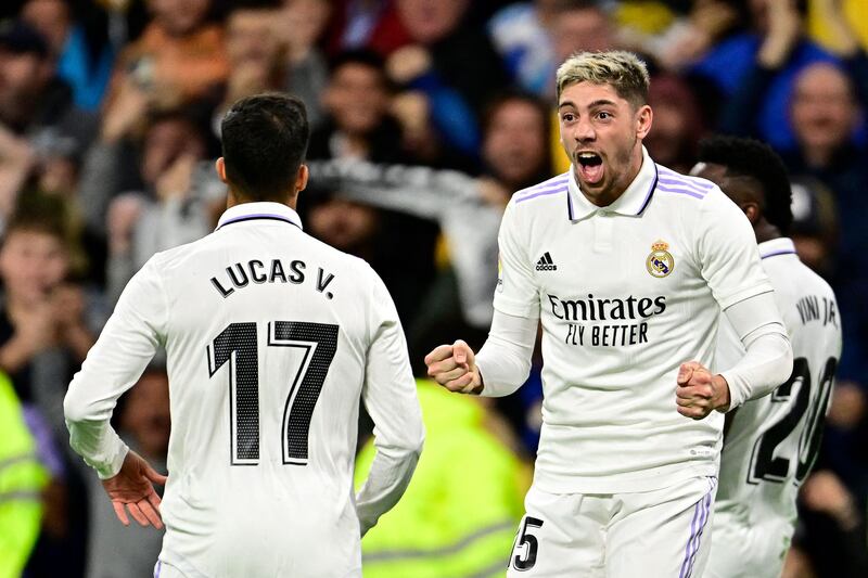 Federico Valverde celebrates with Lucas Vazquez after scoring Real Madrid's third goal. AFP