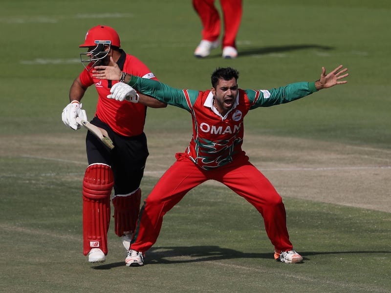 ABU DHABI, UNITED ARAB EMIRATES - JANUARY 16: Bilal Khan of Oman celebrates the wicket of 	Babar Hayat of Hong Kong during the Desert T20 Challenge match between at Hong Kong and Oman at Sheikh Zayed Stadium on January 16, 2017 in Abu Dhabi, United Arab Emirates.  (Photo by Francois Nel/Getty Images)