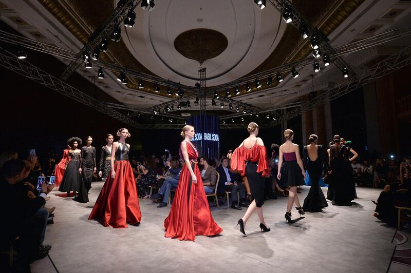 Models present creations by Denise Soda for her late husband, Lebanese fashion designer Bassil Soda, during the 'Designers and Brands' Fashion Show in Beirut, Lebanon.  EPA