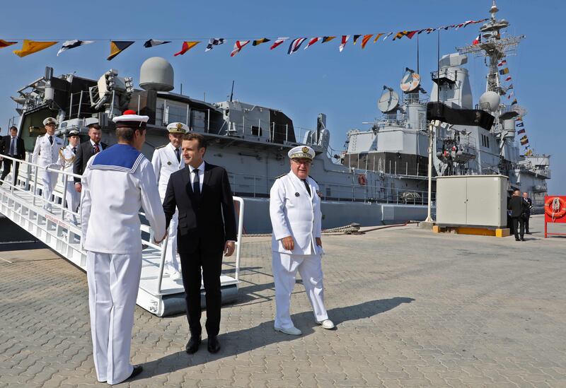 A military band played La Marseillaise and an honour guard met Mr Macron before he boarded and walked through the French frigate Jean Bart.  Ludovic Marin / AFP