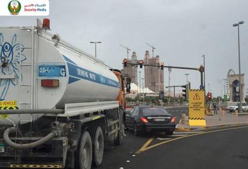 A picture released by the Ministry of Interior’s security media department of a car suddenly pulling out at a junction, cutting off a water truck. Courtesy Security Media