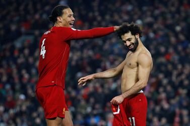 Mohamed Salah celebrates with Virjil van Dijk after scoring the second goal against Manchester United, the latest win in Liverpool's incredible run. Reuters