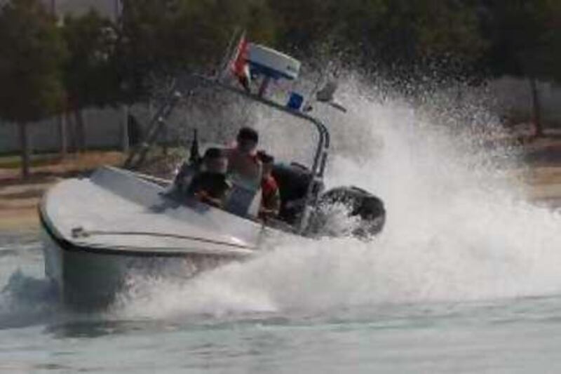 Abu Dhabi - February 23, 2009: The Interceptor fast patrol boat used by the UAE Armed Forces demonstrates it's speed during the International Defence Exhibition and Conference 2009 (IDEX) at the Abu Dhabi National Exhibition Centre. ( Philip Cheung / The National )  *** Local Caption ***  PC0381-IDEX.jpgna06 ma patrol boat.jpg