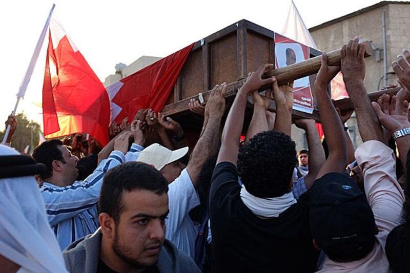 Shiite protesters hold a funeral procession in the village of Aali after a resident was killed in an accident allegedly involving a police car.