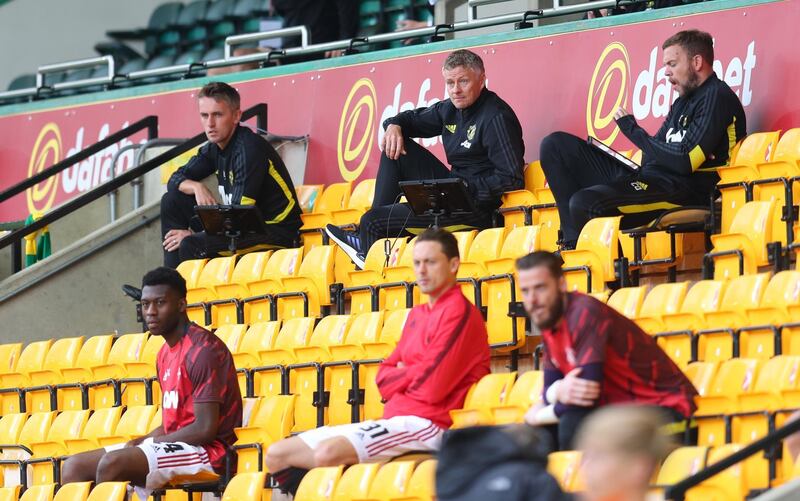 United manager Ole Gunnar Solskjaer, back row centre, sat in the stands. Reuters
