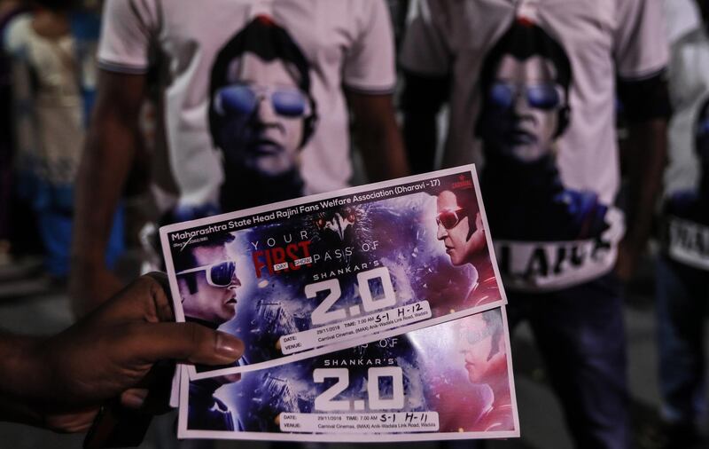 A fan shows tickets to the first day of screening of "2.0." EPA