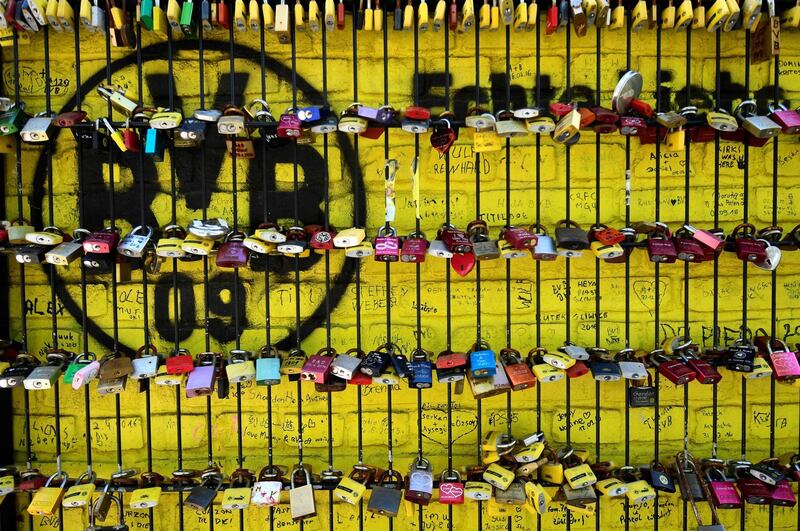 A picture taken shows love locks on a fence in front of the Signal Iduna Park stadium of Bundesliga football club Borussia Dortmund in Dortmund, western Germany. AFP