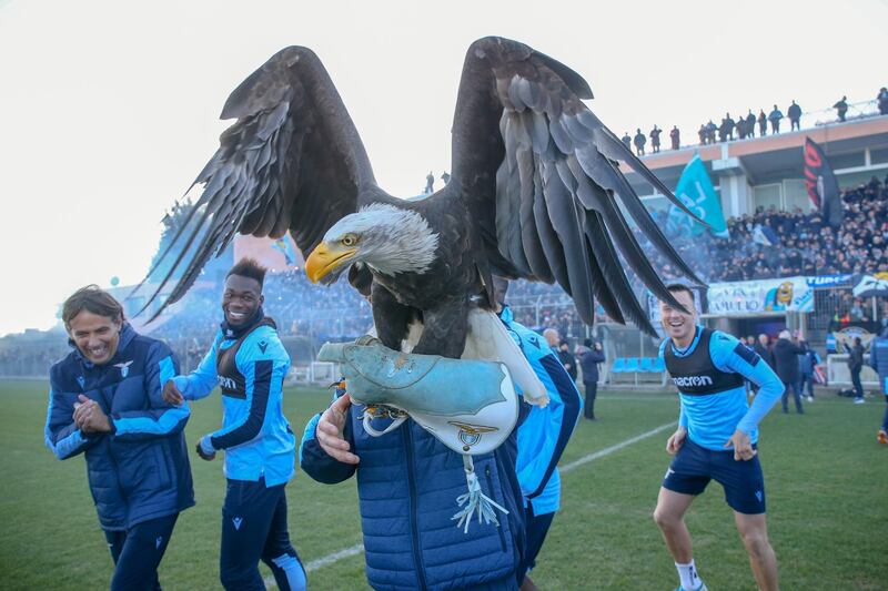 Lazio manager Simone Inzaghi with the club's eagle mascot during celebrations in Rome on Monday, December 30, after winning the Italian Super Cup against Juventus. Getty