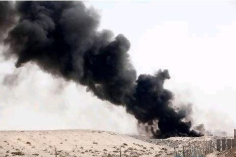 A fire burns on the landfill at the Jebel Ali Waste Management Complex.