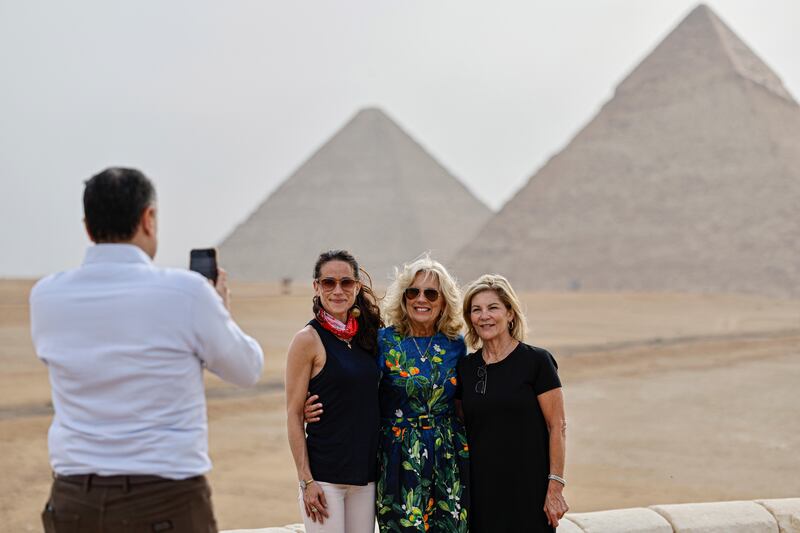 From left, Mr Essa takes a picture of Ashley Biden, Mrs Biden and Ms Jacobs. EPA