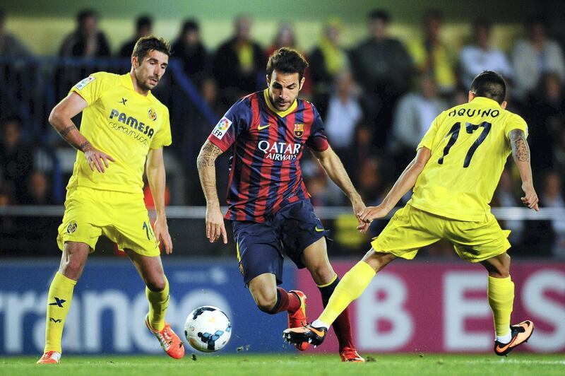 VILLARREAL, SPAIN - APRIL 27:  Cesc Fabregas of FC Barcelona competes for the ball with Cani (L) and Javier Aquino of Villarreal CF during the La Liga match between Villarreal CF and FC Barcelona at El Madrigal on April 27, 2014 in Villarreal, Spain.  (Photo by David Ramos/Getty Images)