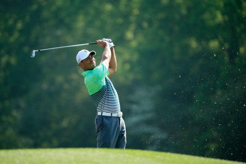 Tiger Woods watches a tee shot during a practice round at the Augusta National Golf Club. Jamie Squire / Getty Images