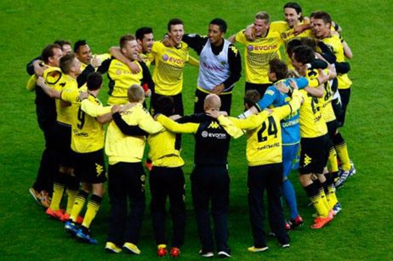 Borussia Dortmund players celebrate after defeating Bayern Munich  to win their first German Cup title. Fabrizio Bensch / Reuters