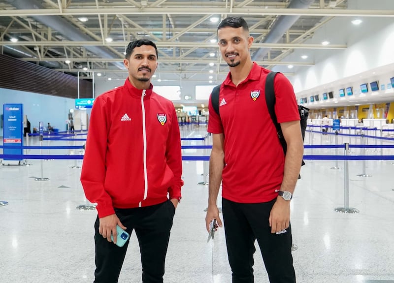 UAE players Khalil Ibrahim, left, and Mohammed Al Shamsi arrive in Doha ahead of their upcoming World Cup play-off against Australia. 