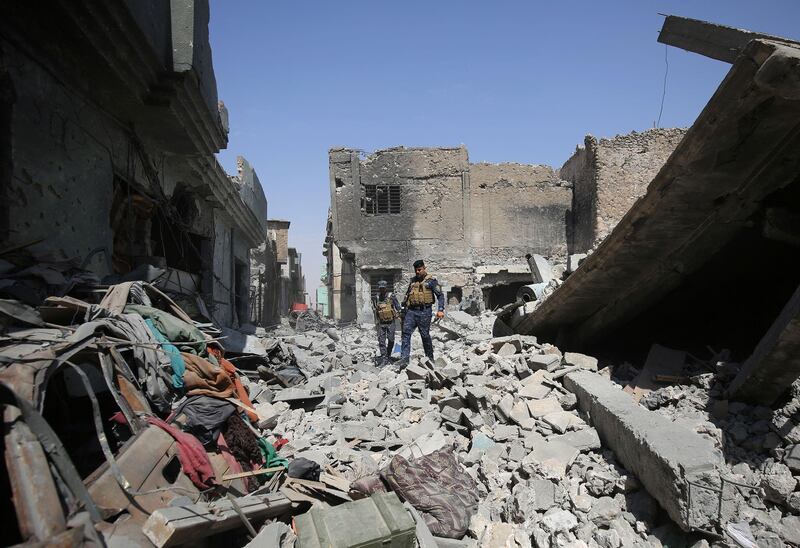 Iraqi forces members patrol in the Old City of Mosul on July 1, 2017 where they are battling some of the last members ISIL in the city. AFP