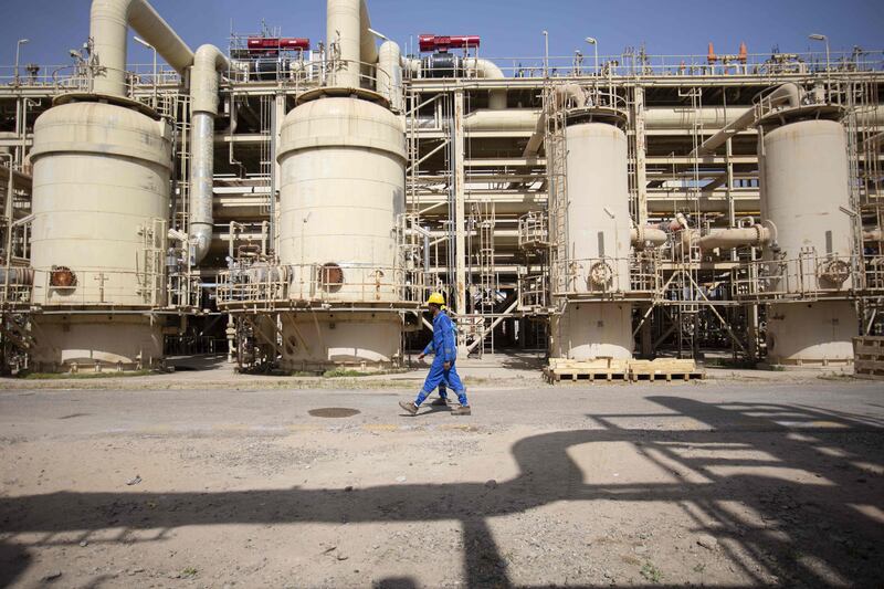 Technicians at the Rumaylah oilfield near Iraq's southern port city of Basra. Iraq exported $11.07 billion worth of oil in March. AFP