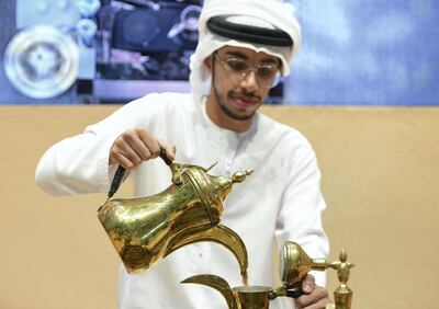 Abu Dhabi, United Arab Emirates - Ahmed Al Shimmari, coffee maker from Abu Dhabi serves at the SIAL Food Pavilion in the Abu Dhabi National Exhibition Centre. Khushnum Bhandari for The National