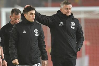 Manchester United's Norwegian manager Ole Gunnar Solskjaer consoles his player after losing the English Premier League football match between Manchester United and Burnley at Old Trafford in Manchester, north west England, on January 22, 2020. Burnley won the match 2-0. - RESTRICTED TO EDITORIAL USE. No use with unauthorized audio, video, data, fixture lists, club/league logos or 'live' services. Online in-match use limited to 120 images. An additional 40 images may be used in extra time. No video emulation. Social media in-match use limited to 120 images. An additional 40 images may be used in extra time. No use in betting publications, games or single club/league/player publications. / AFP / Paul ELLIS / RESTRICTED TO EDITORIAL USE. No use with unauthorized audio, video, data, fixture lists, club/league logos or 'live' services. Online in-match use limited to 120 images. An additional 40 images may be used in extra time. No video emulation. Social media in-match use limited to 120 images. An additional 40 images may be used in extra time. No use in betting publications, games or single club/league/player publications.