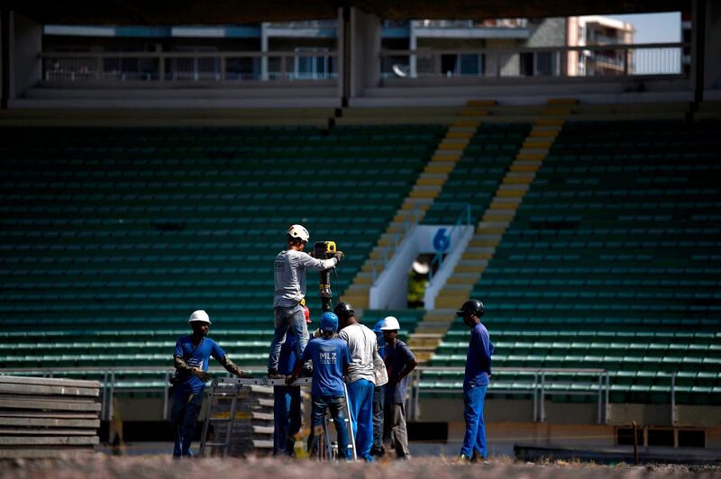 Men work in the construction of a temporary field hospital for coronavirus patients at Maracana Stadium. AFP