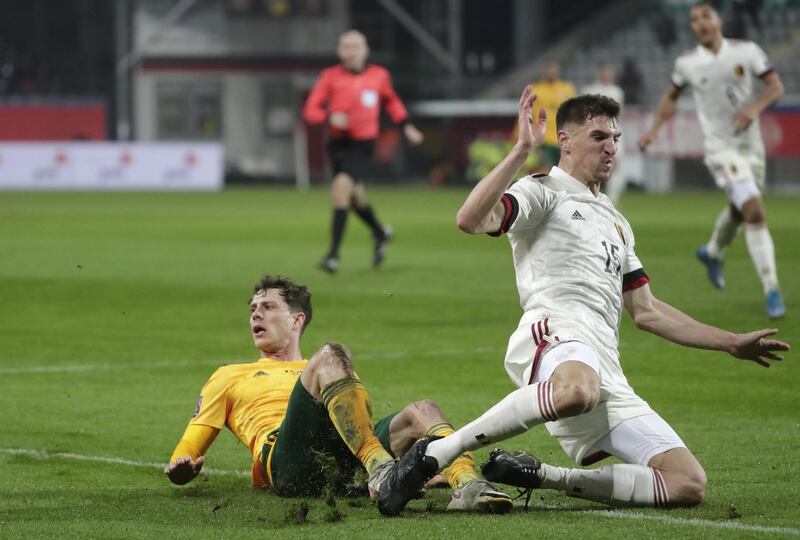 epa09094984 James Lawrence of Wales (L) and Thomas Meunier of Belgium (R) in action during the FIFA World Cup 2022 qualification match between Belgium and Wales in Leuven, Belgium, 24 March 2021.  EPA/STEPHANIE LECOCQ