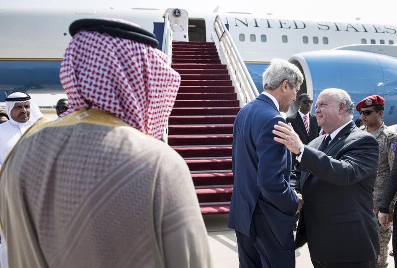 The US secretary of state John Kerry, centre, with Joseph W Westphal, the US Ambassador to Saudi Arabia. Mr Kerry's visit was aimed at pinning down how much support regional allies are willing to give to the US plan to beat back ISIL. Brendan Smialowski / AP Photo