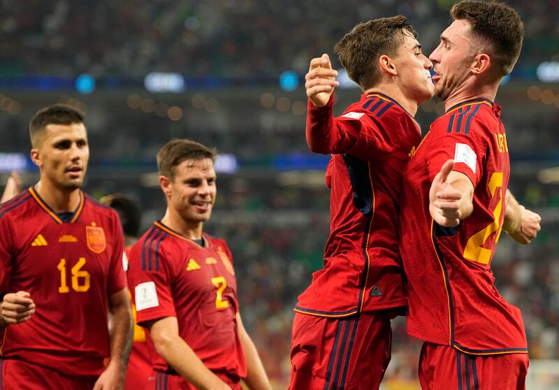 Spain's Gavi, second right, celebrates with Spain's Aymeric Laporte after scoring his side's fifth goal. AP 