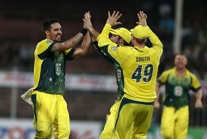 
SHARJAH , UNITED ARAB EMIRATES Ð Oct 7 , 2014 : Mitchell Johnson ( left ) celebrating after taking the wicket of Anwar Ali in the 1st One Day International cricket match between Pakistan vs Australia at Sharjah Cricket Stadium in Sharjah. Australia won the match by 93 runs. ( Pawan Singh / The National ) For Sports. Story by Paul