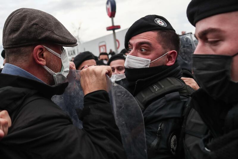 Confrontation but no violence between a demonstrator and a police office at the Bogazici University protests in Istanbul. EPA