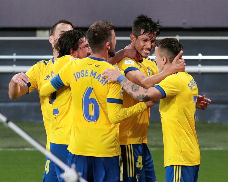 Cadiz's Marcos Mauro celebrates with his teammates after scoring to make it 2-1. EPA