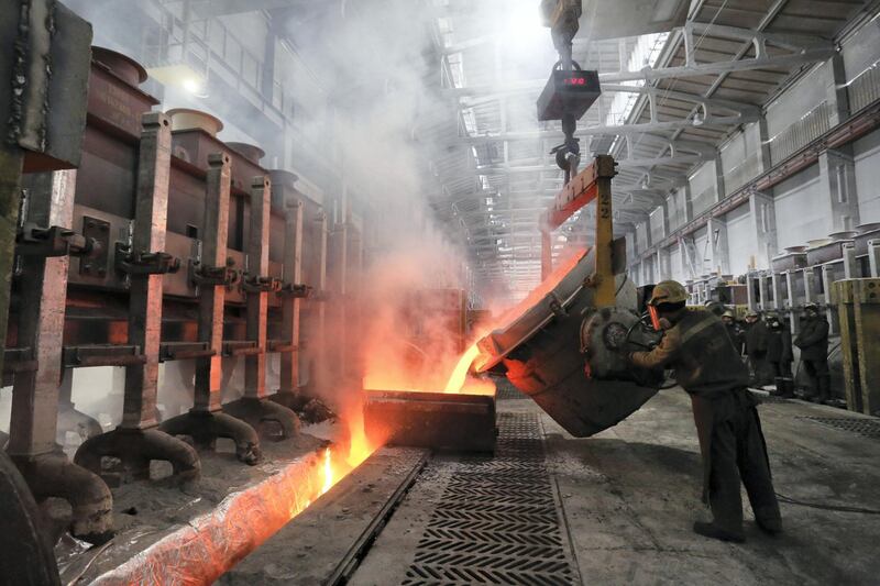 FILE: A worker loads a liquid electrolyte into the electrolysis bath inside the electrolysis shop at the Krasnoyarsk aluminum smelter, operated by United Co. Rusal, in Krasnoyarsk, Russia, on Thursday, March 2, 2017. United Co. Rusal -- the biggest aluminum maker outside China -- and seven other Deripaska-linked firms were the most prominent targets in a list of 12 Russian companies the U.S. hit with sanctions on Friday intended to punish the country for actions in Crimea, Ukraine and Syria, and attempting to subvert Western democracies. Our editors select the best archive images on Deripaska and Rusal. Photographer: Andrey Rudakov/Bloomberg 