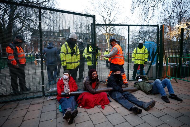 Environmental protesters lock themselves together at a 'Stop HS2' camp at Euston Square Gardens in London. Getty Images
