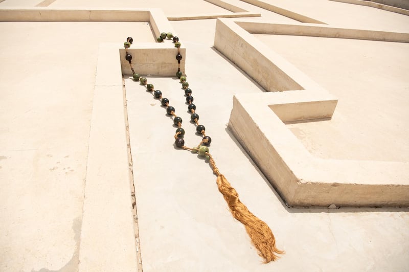 A contemporary twist to prayer beads or 'misbah', created by The Lel Collection, a studio in Pakistan. The beads are lapis lazuli, while the threads are woven gold and silver threads. Courtesy Irthi