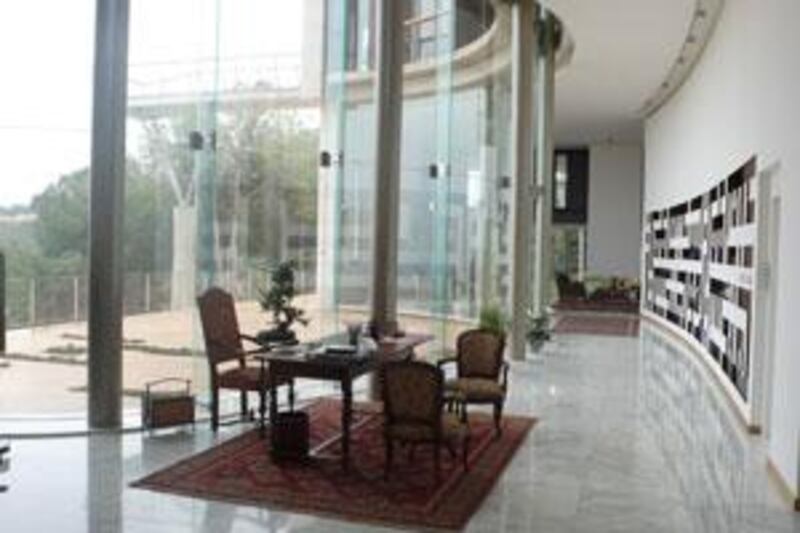 The Sehnaoui residence in Beirut.  On the right wall is the inset shelf that launched the whole project. It is a digitised interpretation of the Arabic script and spells out the owners' names - Maurice and Hind - when seen upside down.