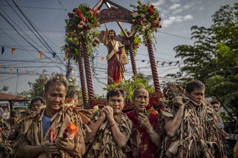 Devotees covered in mud and dried banana leaves take part in the Taong Putik ("mud people") Festival  in the village of Bibiclat in Aliaga town, Nueva Ecija province, Philippines. Each year, the residents of Bibiclat village in Aliaga town celebrate the Feast of Saint John by covering themselves in mud, dried banana leaves, vines, and twigs as part of a little-known Catholic festival. Getty Images