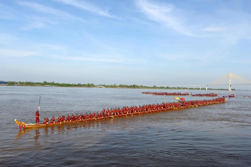 The world's longest dragon boat carrying 179 rowers sails along the Mekong river in Cambodia. AFP