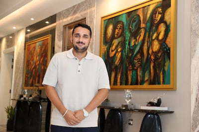 Ali Raza Beig shows the art inside the family's Dh160 million Dubai home. Pawan Singh / The National