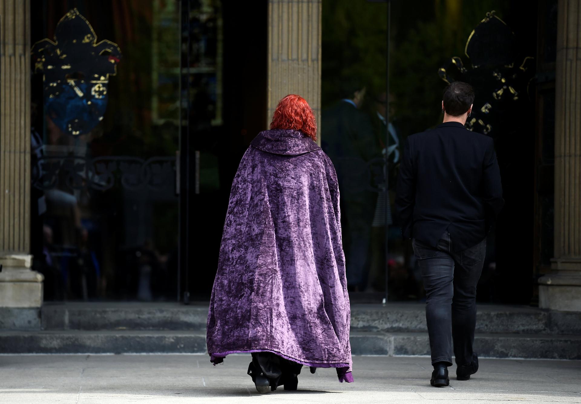 A mourner wearing Harry Potter themed cloak. Reuters