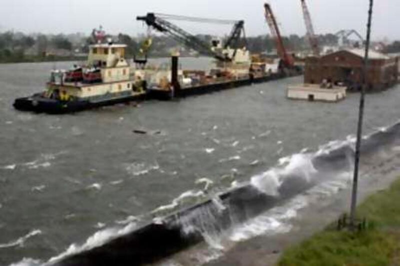 Water breaks over the I-wall along the industrial canal as Hurricane Gustav arrives in New Orleans, La., Monday, Sept. 1, 2008. (AP Photo/Eric Gay) *** Local Caption ***  LAEG101_Gustav_New_Orleans.jpg