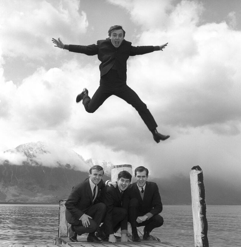 In this April 25, 1964 file photo, Gerry Marsden leaps over his band, the Pacemakers. Gerry Marsden, the British singer and lead singer of Gerry and the Pacemakers. AP File