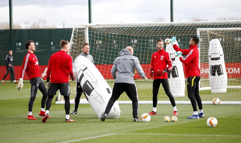 Manchester United players David de Gea and Sergio Romero take part in goalkeeper drills.