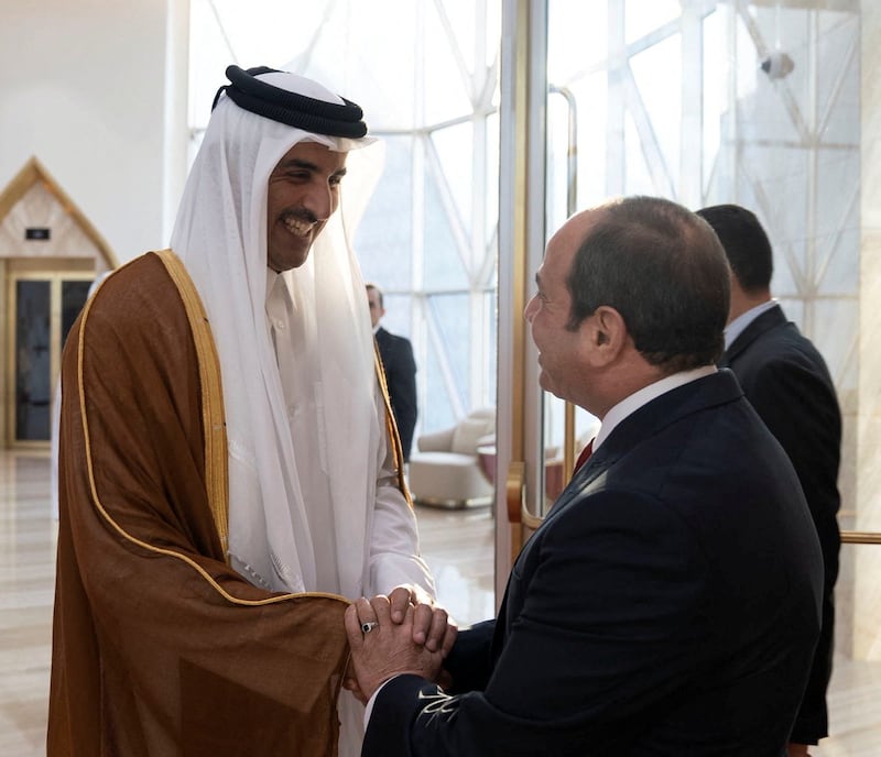 Qatari Emir Sheikh Tamim shakes hands with Egyptian President Abdel Fattah El Sisi in Doha. Reuters