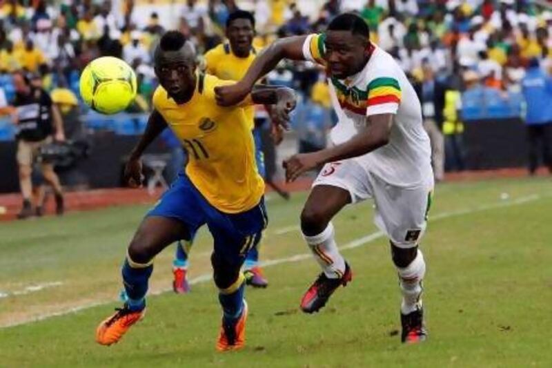 Eric Mouloungui, left, in action for Gabon in the African Cup of Nations, is ready for a change. Thomas Mukoya / Reuters