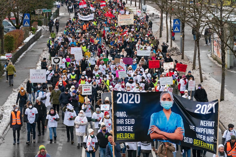 Protesters take part in a demonstration against the government's measures taken in order to limit the spread of the coronavirus, in Bregenz, Austria. AFP