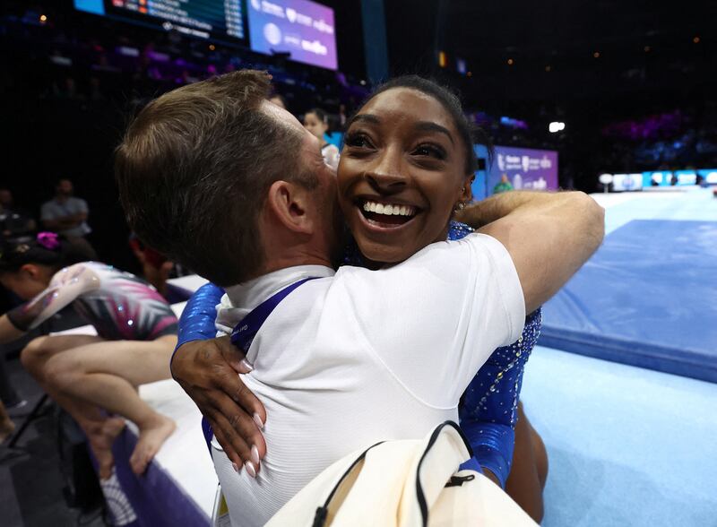 Simone Biles of the US celebrates with coach Laurent Landi after winning the women's individual all-around final at the 2023 World Artistic Gymnastics Championships in the Sportpaleis, Antwerp, Belgium. Reuters