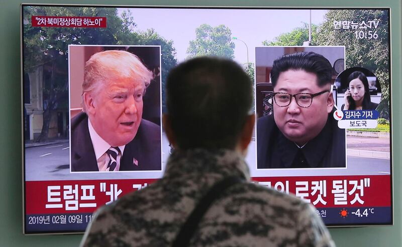 A man watches a TV screen showing images of U.S. President Donald Trump, left, and North Korean leader Kim Jong Un during a news program at the Seoul Railway Station in Seoul, South Korea, Saturday, Feb. 9, 2019. Trump said Friday that he will hold his second summit with Kim in Hanoi and predicted that the authoritarian country would someday become "a great Economic Powerhouse" under Kim's leadership. Korean letters on the screen read: "North Korea will become a different kind of rocket - an economic one!" (AP Photo/Ahn Young-joon)