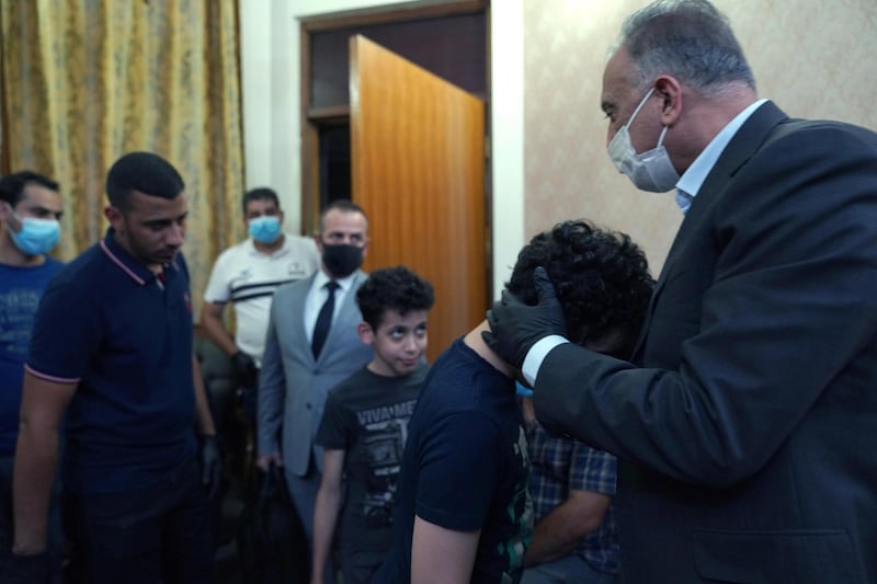 Iraqi Prime Minister Mustafa al-Kadhimi visits and offers condolences to the family of the late former government advisor and political analyst Hisham al-Hashemi, who was killed by gunmen, in Baghdad, Iraq July 8, 2020. Picture taken July 8, 2020. Iraqi Prime Minister Media Office/Handout via REUTERS ATTENTION EDITORS - THIS IMAGE WAS PROVIDED BY A THIRD PARTY