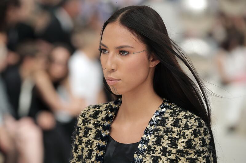 Make-up was kept light for First Nation model Quannah Chasinghorse at Chanel. EPA
 