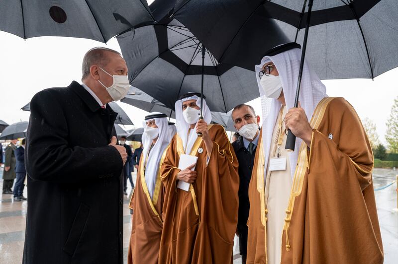 Dr Sultan Al Jaber, Minister of Industry and Advanced Technology and managing director and group chief executive of Adnoc, is greeted by Mr Erdogan. Mohamed Al Hammadi / Ministry of Presidential Affairs