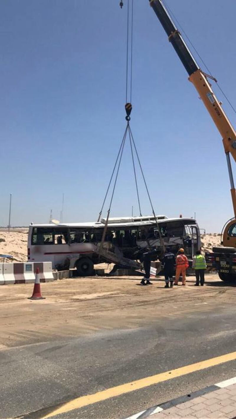 A crane lifts the bus after the crash in Dubai in which seven people were killed. Courtesy Dubai Police